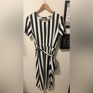 Large black and white striped knee length dress